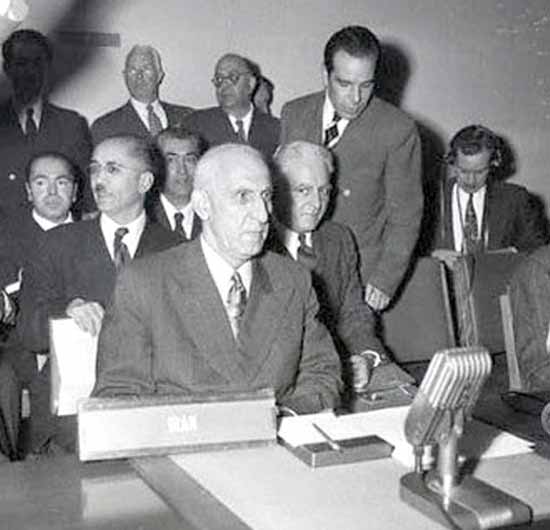 Dr Mosaddegh and Dr Fatemi (standing) during a speech at the United Nations